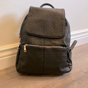 Medium Faux Leather Backpack w/ 2 large sections, 1 small and 1 hidden pocket.